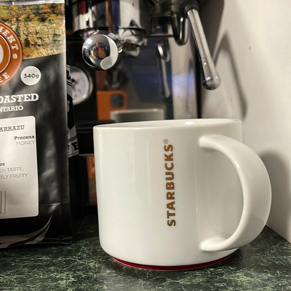 Starbucks Other - Starbucks 2012 gold lettering stackable cup with red bottom rim